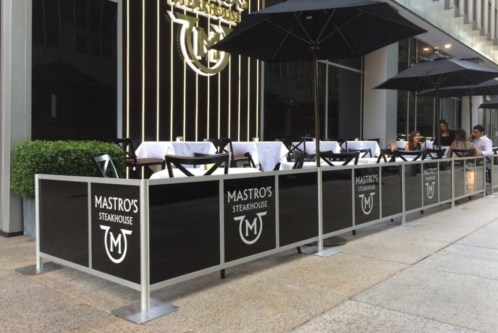 Maestro's Steakhouse Outdoor seating cafe area with sidewalk partitions by New York City Signs & Awnings